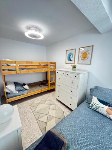 a bedroom with a bed and a bunk bed at Casa Salamanca La Mata in Torrevieja