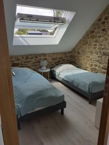 Postel nebo postele na pokoji v ubytování Longère dans le Golfe du Morbihan