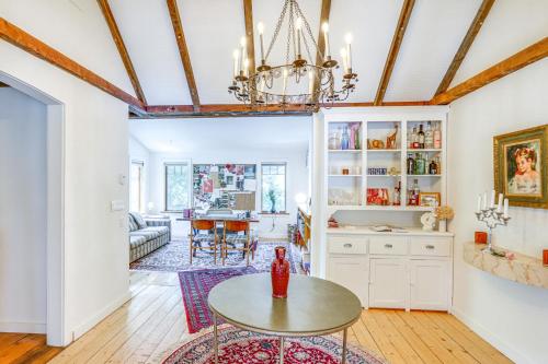 a dining room and living room with a table at 9 Mi to Dtwn Hudson Pet-Friendly Home with Pool in Craryville