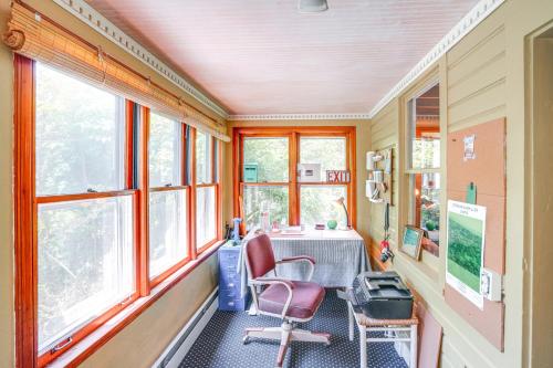 an office with a desk and chairs in a room with windows at 9 Mi to Dtwn Hudson Pet-Friendly Home with Pool in Craryville