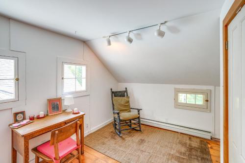 an attic room with a desk and a chair at 9 Mi to Dtwn Hudson Pet-Friendly Home with Pool in Craryville
