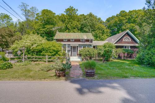 a house with a fence in front of it at 9 Mi to Dtwn Hudson Pet-Friendly Home with Pool in Craryville