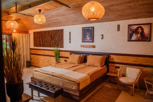a bedroom with a large bed in a room at Cossara luxury villas - Adults Only in Balchik