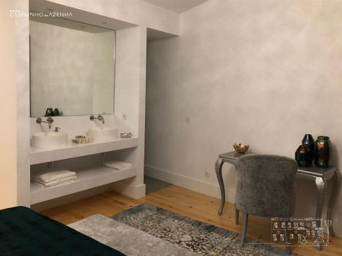 a bathroom with two sinks and a mirror at Casalinho da Azenha - Charm House in Sintra
