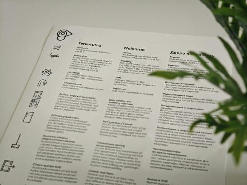 a page of a book with a plant at Spacious Apartment for 6 with Sauna in Oulu