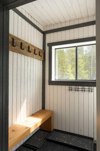 a sauna with a bench and a window in it at St Marys Glacier Retreat A Cozy Lakeside Escape in Idaho Springs