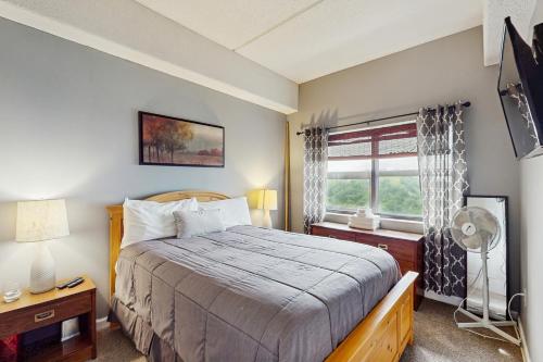 a bedroom with a bed and a window at 303 Sugar Top Dr #2901 in Sugar Mountain