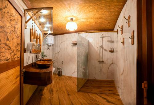 a bathroom with a tub and a sink and a shower at Cossara luxury villas - Adults Only in Balchik