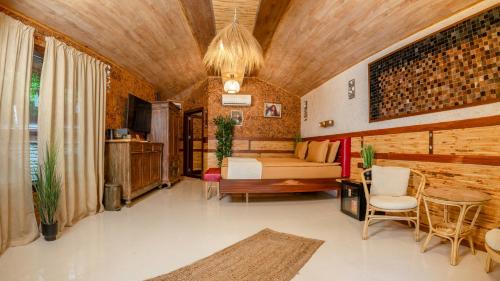 a bedroom with a bed and a table and chairs at Cossara luxury villas - Adults Only in Balchik