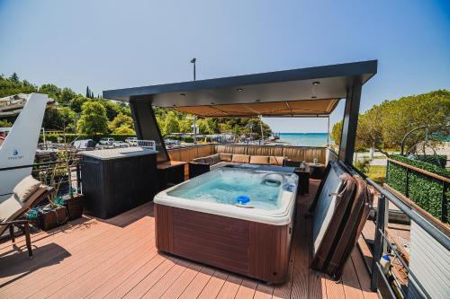 a hot tub on the deck of a boat at Floating house BRAVIA in Portorož