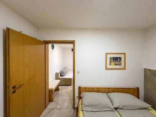 a room with a bed and a door to a bedroom at Lighthouse in Vodice