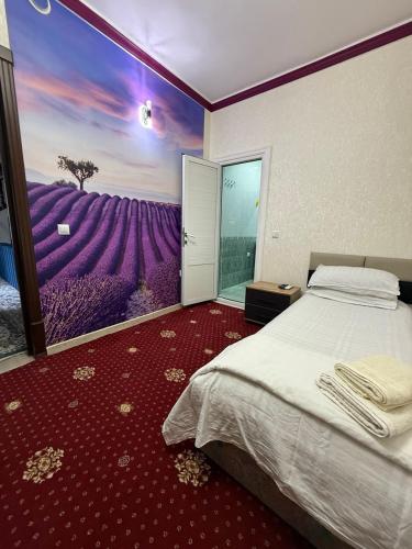 Ένα ή περισσότερα κρεβάτια σε δωμάτιο στο Heyvah - Guest House in Tashkent