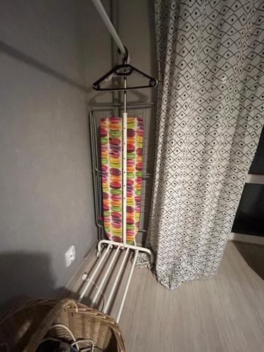 a towel rack with towels in it next to a window at Апартаменти Світлий Ранок та Затишний Вечір in Rivne