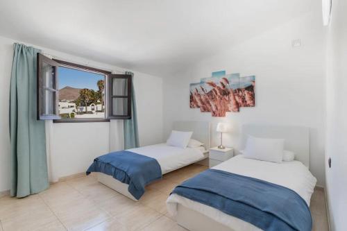Ένα ή περισσότερα κρεβάτια σε δωμάτιο στο Casa Aurora