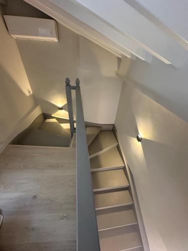 a staircase leading up to a loft in a house at John&Nansy Cozy Apartment 2 in Lésvos