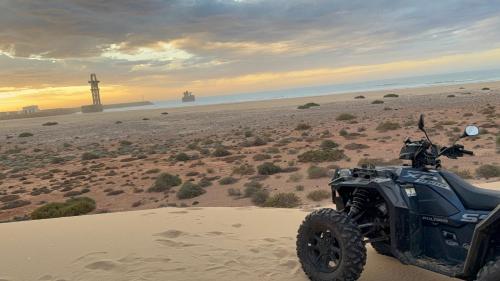 an atv parked in the sand in the desert at Ciel&Azur in Sidi Ifni