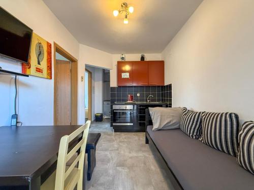 a living room and kitchen with a couch and a table at Lighthouse in Vodice