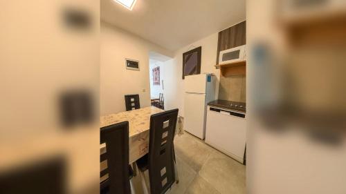 a small kitchen with a counter and a refrigerator at Lighthouse in Vodice