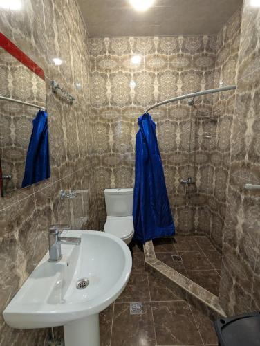 a bathroom with a sink and a toilet and a shower at Panorama hotel kobuleti in Kobuleti