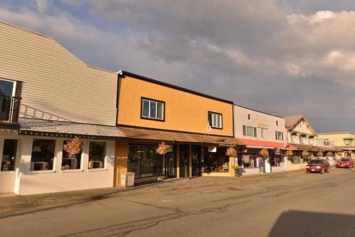 an empty street in a small town with buildings at Gulf Island View Suite in Chemainus