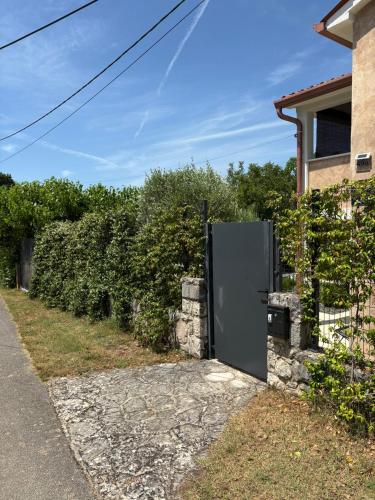 a refrigerator in the side of a house at Wellness House Oliva, Heated Pool, Sauna and Jacuzzi in Labin