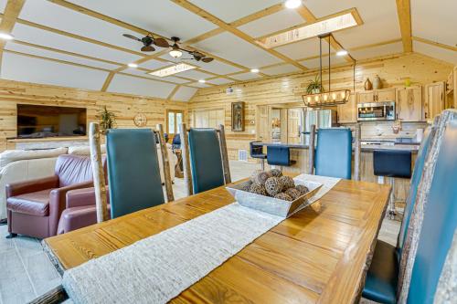 a dining room and kitchen with a wooden table at Walk to Shay Lake Updated Home with Water View! in Silverwood