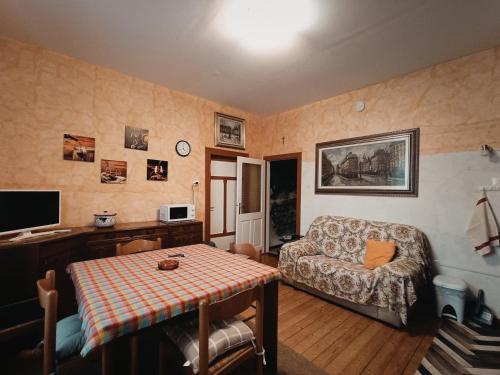 a living room with a couch and a table at Il Pellicano in Rovereto