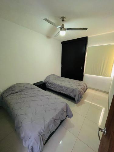Ένα ή περισσότερα κρεβάτια σε δωμάτιο στο casa esperanza