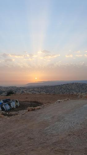 a view of the sunset from the top of a hill at Azour House in Taghazout