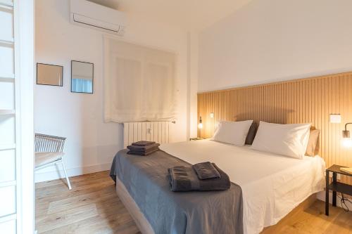 a bedroom with a large white bed in a room at AB40 Home Design in Madrid