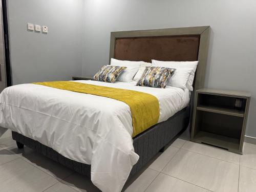 Ένα ή περισσότερα κρεβάτια σε δωμάτιο στο Mercy Accommodation Guest House