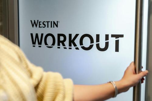 a person holding a sign with the words western workout at The Westin Charlotte in Charlotte