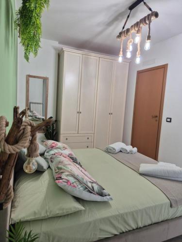 a bedroom with two beds and a mirror at Factory 219 Apartment Guidonia in Guidonia