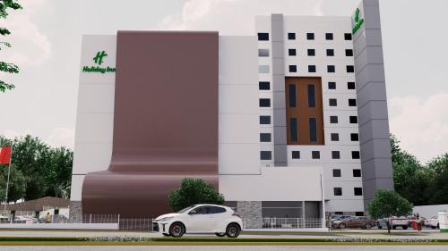 a white car parked in front of a building at Holiday Inn Guadalajara Patria-Universidad by IHG in Guadalajara
