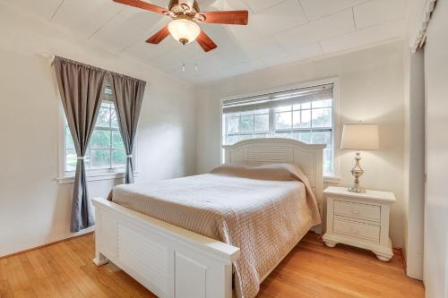 a bedroom with a bed and a ceiling fan at Boat Lift and Private Dock Riverfront LaBelle Gem in La Belle