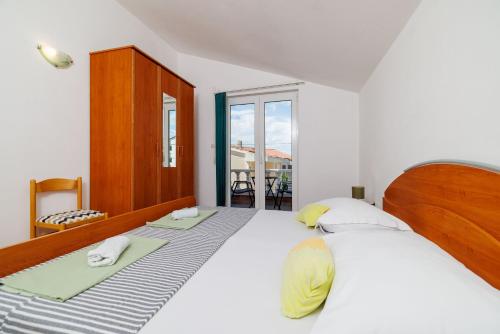 Postel nebo postele na pokoji v ubytování Apartments Krunoslav