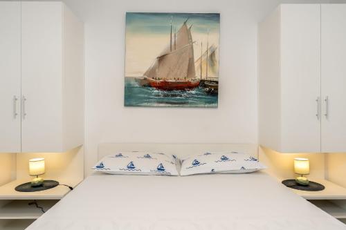 Postel nebo postele na pokoji v ubytování Apartment UGA