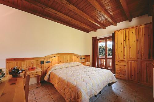 Postel nebo postele na pokoji v ubytování Albergo Piazzatorre