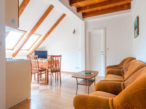 a living room with a couch and a table at Apartments Kirigin in Dubrovnik