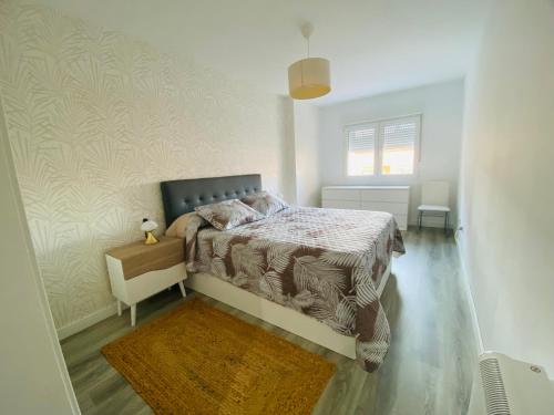 Ένα ή περισσότερα κρεβάτια σε δωμάτιο στο Apartamento Vidal