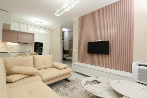 Una televisión o centro de entretenimiento en Eloise Apartament