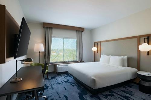 a hotel room with a large bed and a window at Fairfield Inn & Suites by Marriott Harlingen in Harlingen