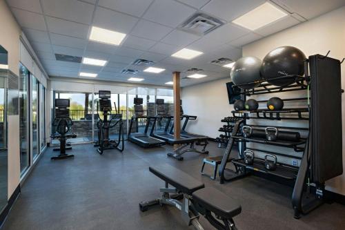 a gym with several treadmills and exercise bikes at Fairfield Inn & Suites by Marriott Harlingen in Harlingen
