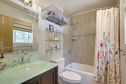 a bathroom with a sink and a toilet and a tub at Lake Arrowhead Family Home with Game Room in Lake Arrowhead