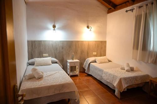 a room with two beds in a room at Casa Juncal in Tarifa