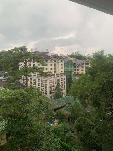 a group of buildings in a city with trees at Suite Escapes at Brenthill Baguio in Baguio