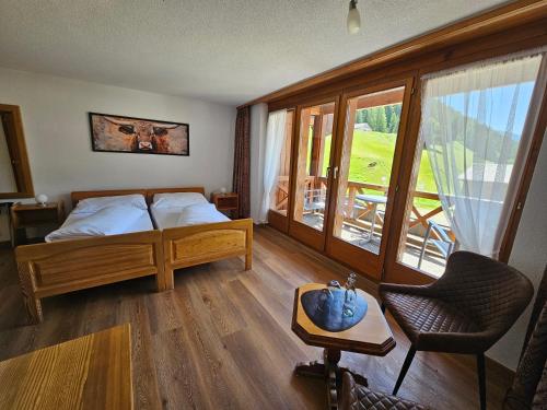 Postel nebo postele na pokoji v ubytování Lärchen Lodge