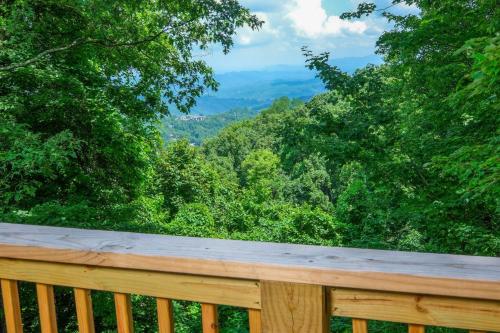 a wooden deck with a view of the mountains at Heavenly View 2308 in Gatlinburg