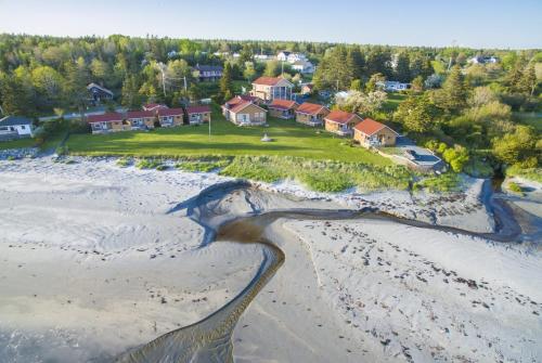 an aerial view of a beach with houses at Hunts Point 1-BR Coastal Retreat - Cottage # 7 in Summerville Centre