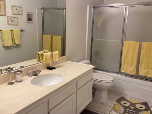 a bathroom with a sink and a shower and a toilet at Relaxing Rancho Mirage home inside Sunrise Country Club in Rancho Mirage